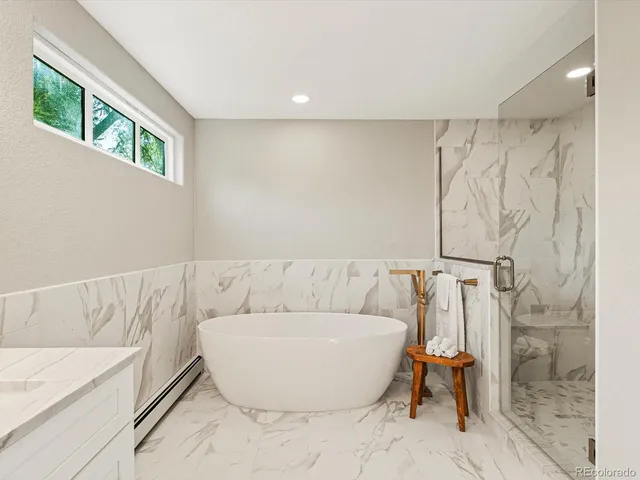 a view of a yard with plants and trees