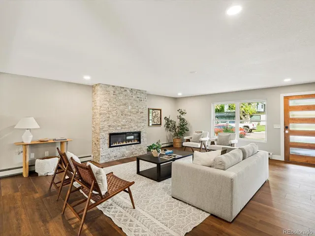 a large white kitchen with refrigerator stove and a sink