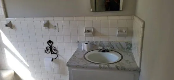 a bathroom with a sink and mirror