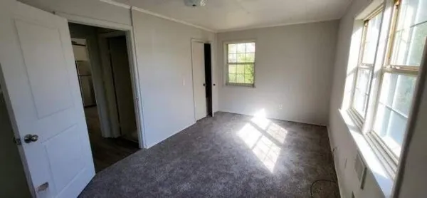 a view of empty room with windows