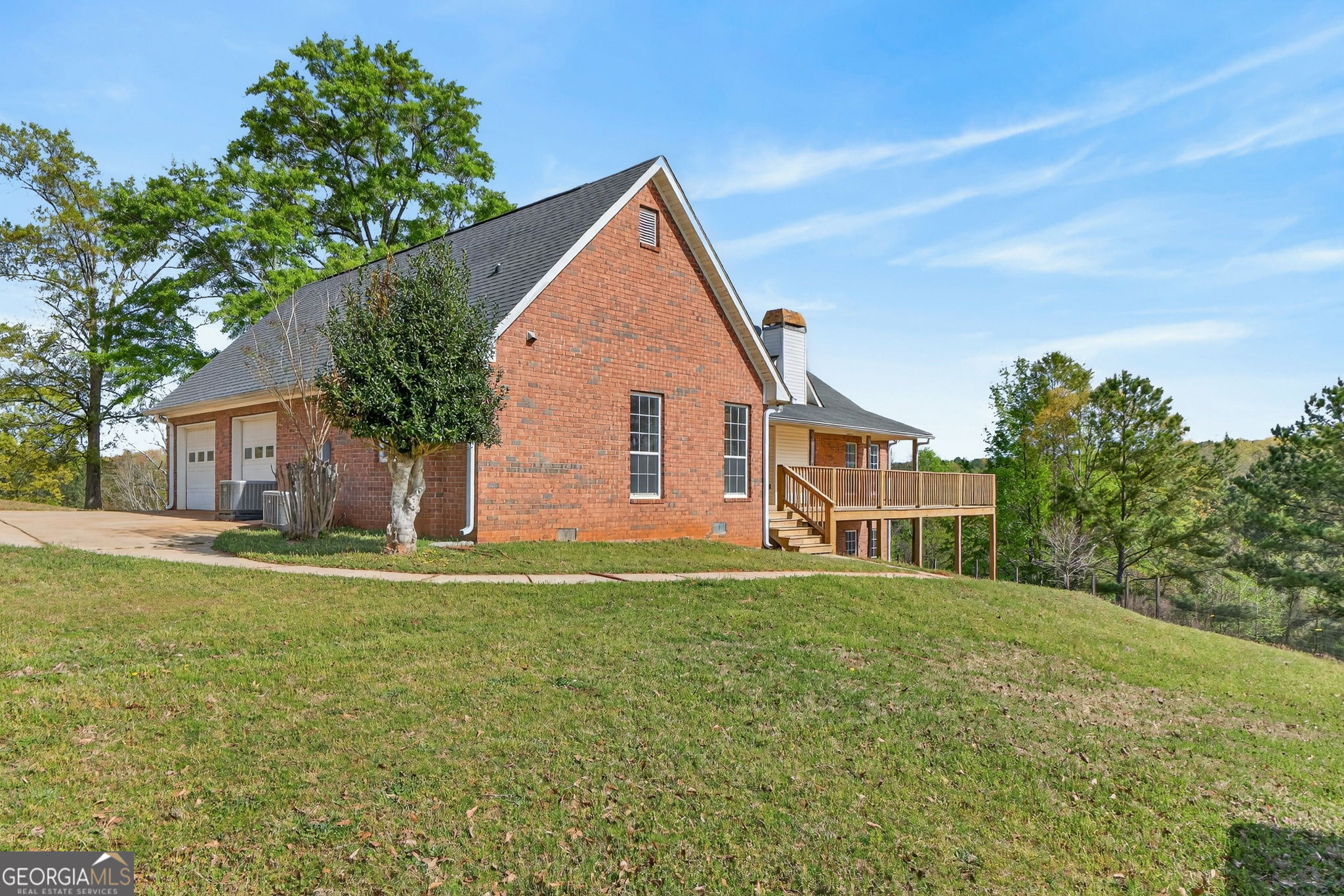 955 Mocassin Gap Road Locust Grove, GA 30248 - Photo 42 of 59 a view of a house with a yard