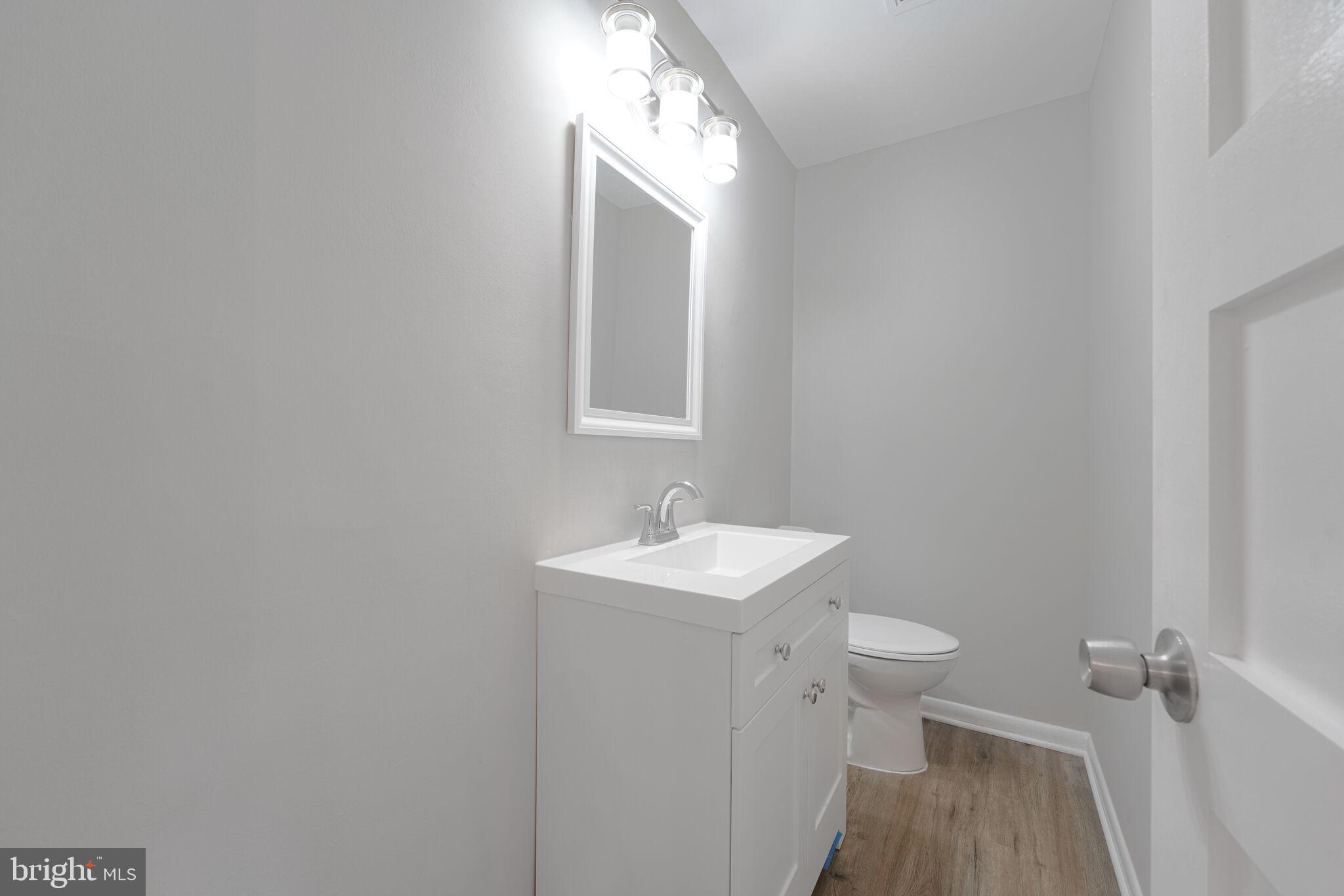 5943 Hall Street Springfield, VA 22152 - Photo 13 of 23 a bathroom with a sink and a mirror