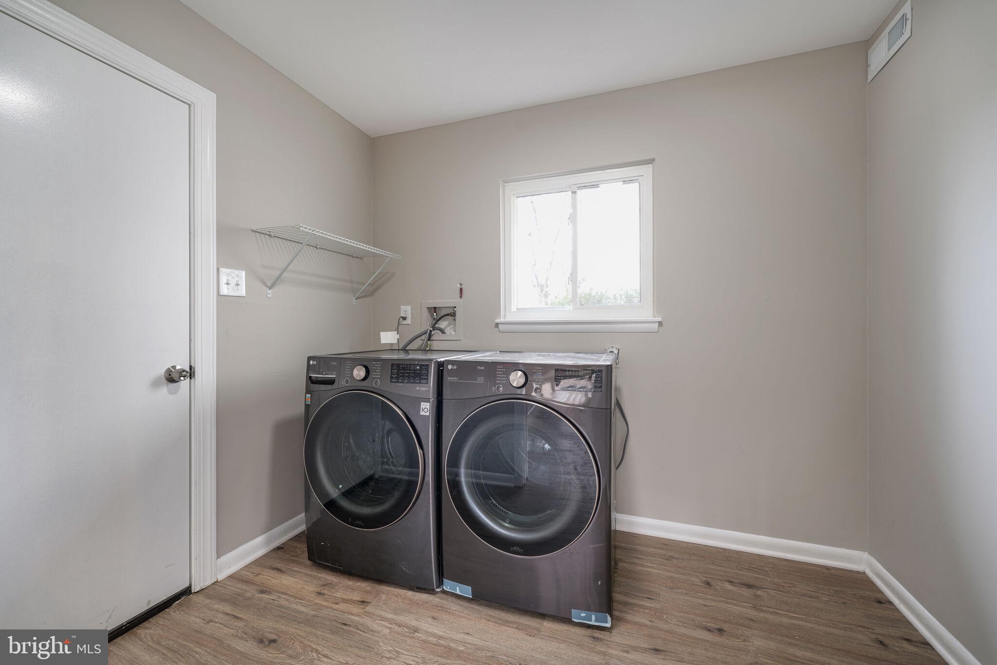 5943 Hall Street Springfield, VA 22152 - Photo 18 of 23 a utility room with sink dryer and washer