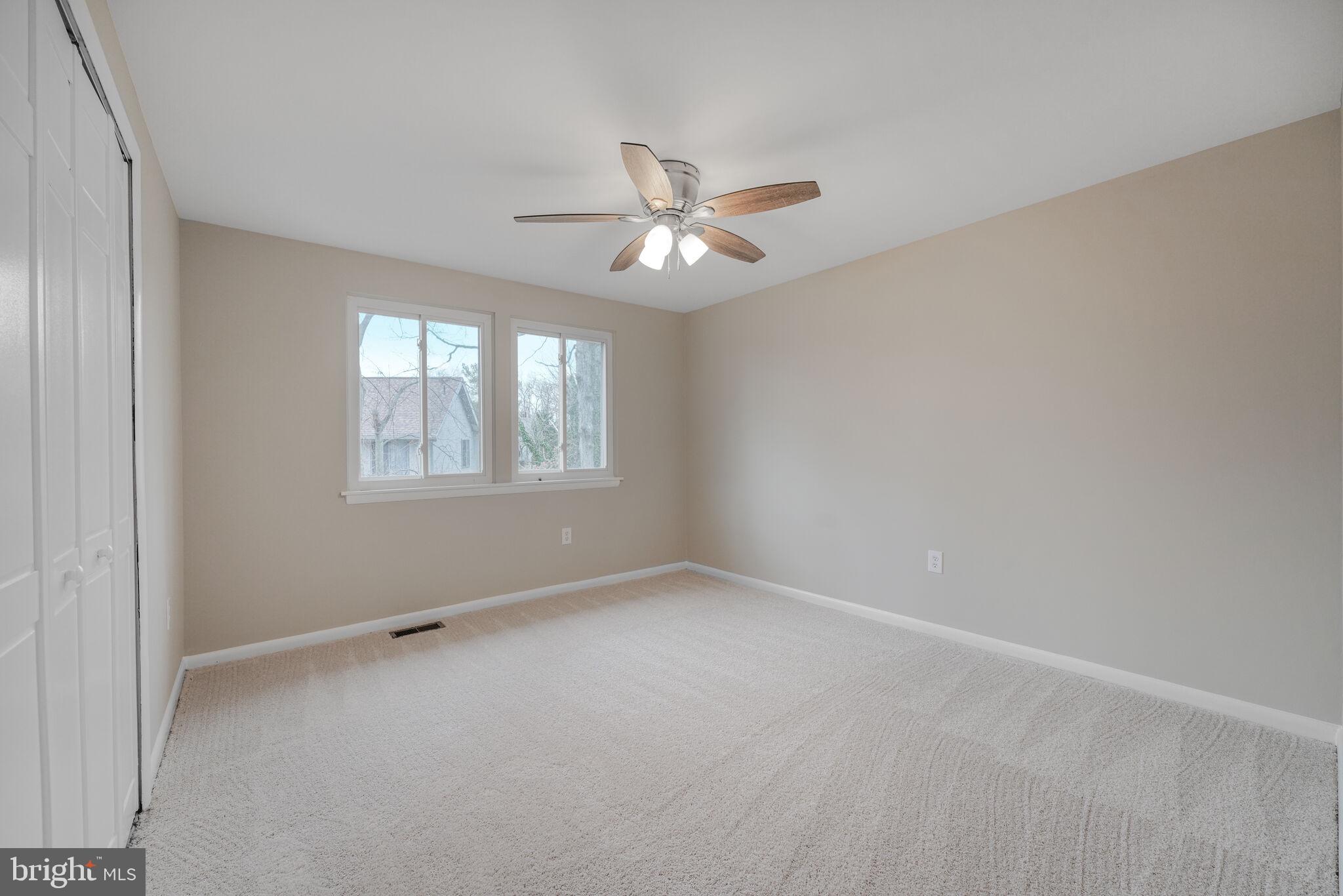 5943 Hall Street Springfield, VA 22152 - Photo 9 of 23 an empty room with a window and a fan