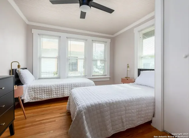 a bedroom with a bed and a couch