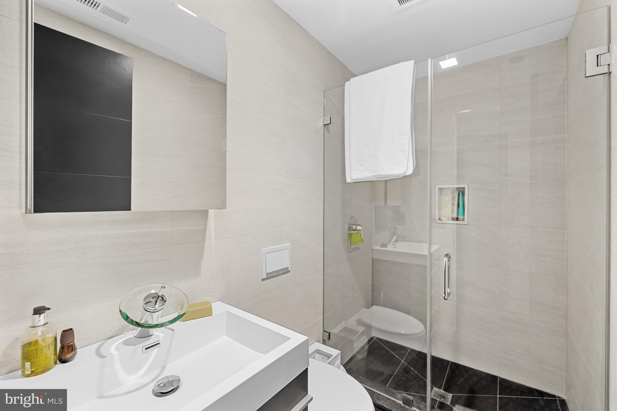 1412 34th Street Northwest Washington, DC 20007 - Photo 6 of 18 a bathroom with a sink toilet and shower