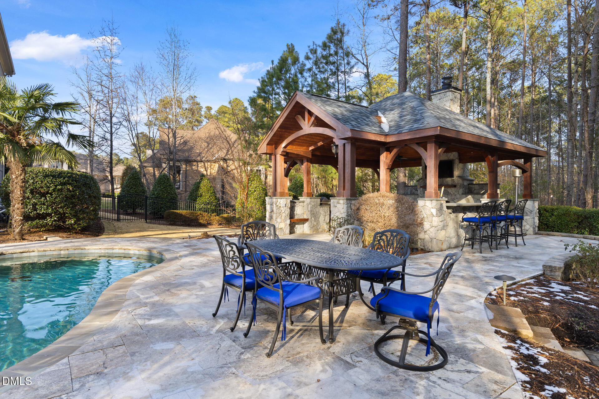 112 Winding Ridge Road Durham, NC 27713 - Photo 42 of 84 an outdoor space with furniture and umbrella