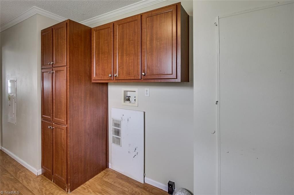 1939 Burney Road Asheboro, NC 27205 - Photo 19 of 28 Laundry area with cabinet storage