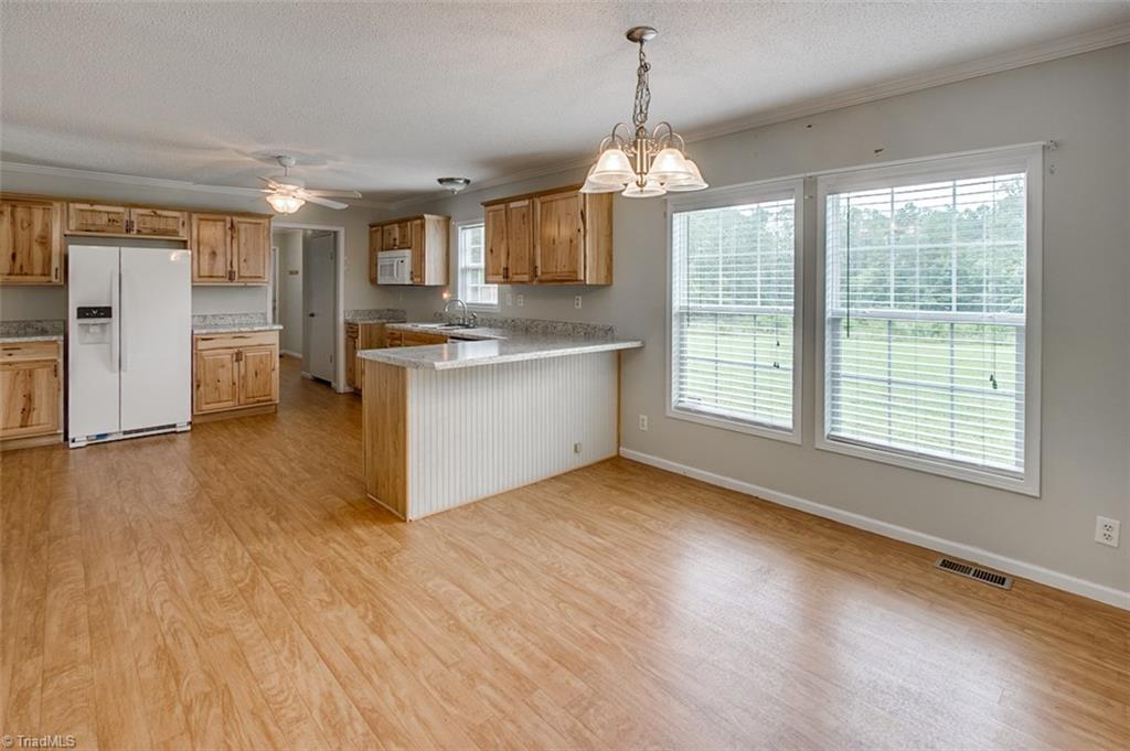 1939 Burney Road Asheboro, NC 27205 - Photo 7 of 28 Dining room, open to kitchen with eat-at bar