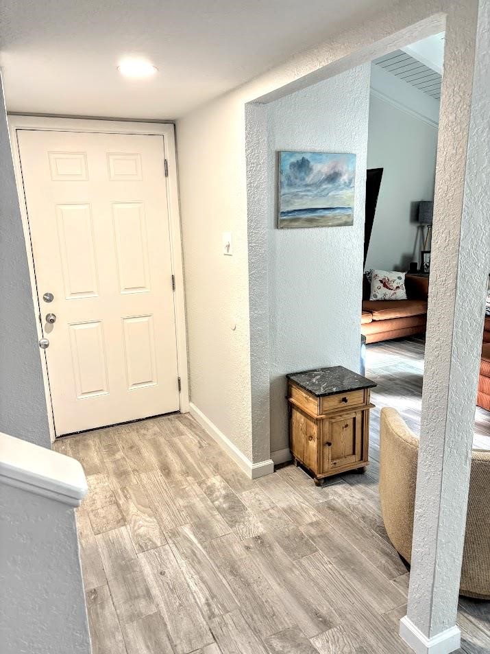 2003 North Fulton Beach Road, Unit 23 Rockport, TX 78382 - Photo 12 of 23 a view of a room with wooden floor and cabinet
