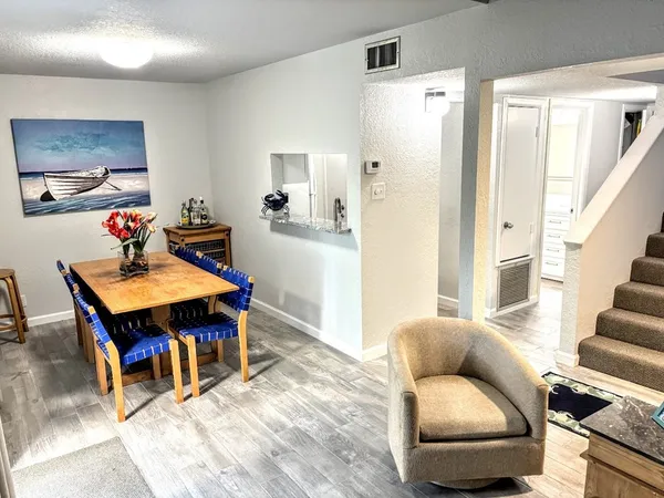 a living room with furniture and a table