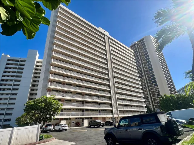 a cars parked in front of a building