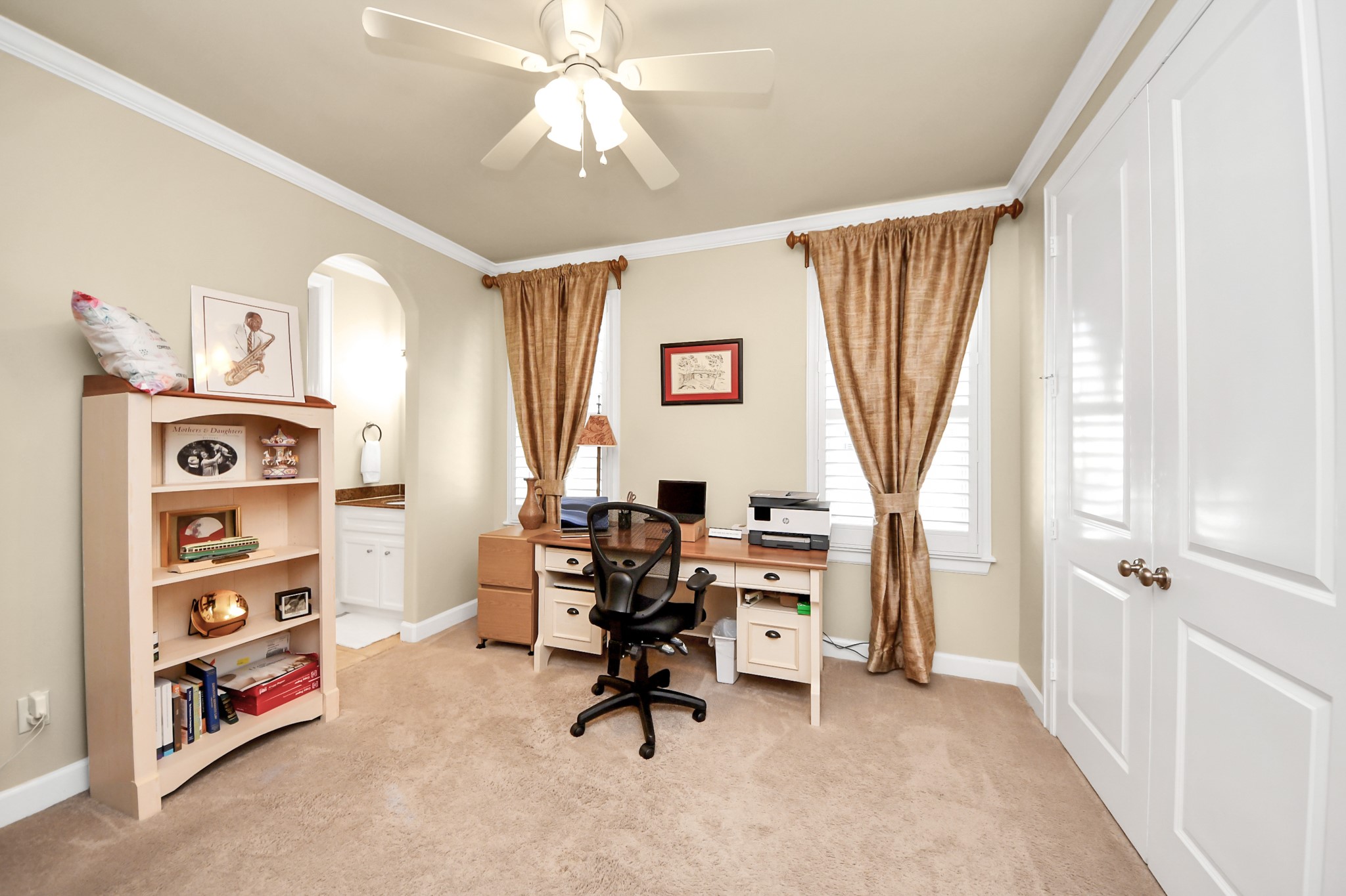 6302 Hermann Lake Drive Houston, TX 77021 - Photo 31 of 50 This versatile room offers the perfect setting for a home office, study, or creative workspace. Large windows with plantation shutters allow natural light to brighten the room, creating an inviting and productive environment.