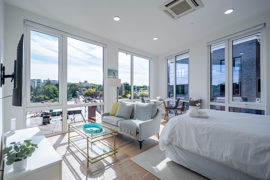 38 Hichborn Street, Unit 401 Boston, MA 02135 - Photo 6 of 11 a living room with furniture and a large window