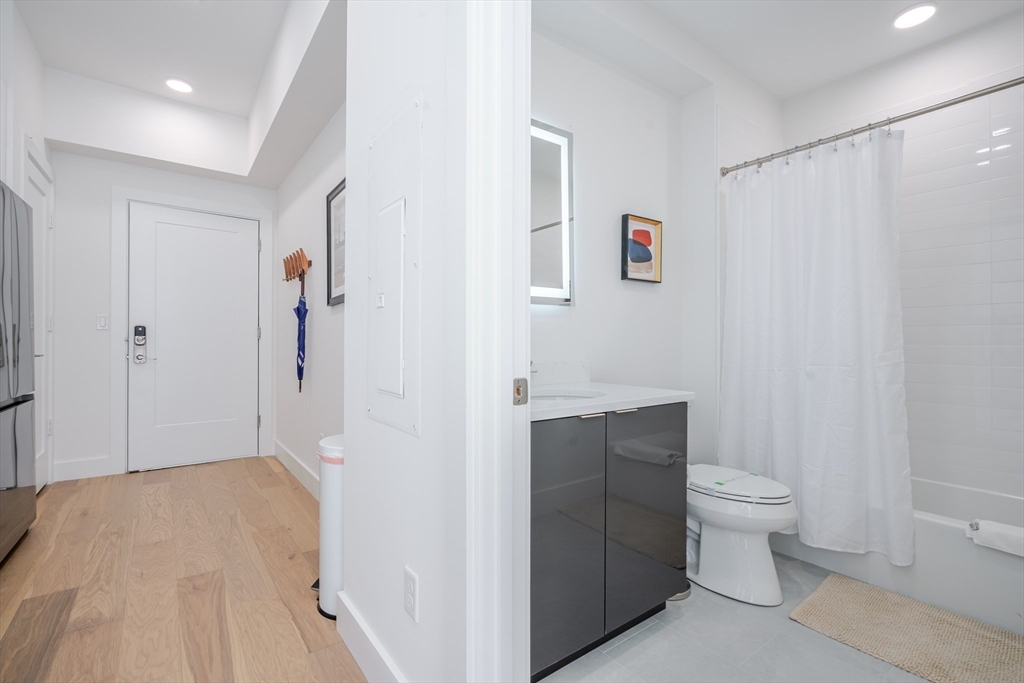 38 Hichborn Street, Unit 401 Boston, MA 02135 - Photo 9 of 11 a bathroom with a sink and toilet