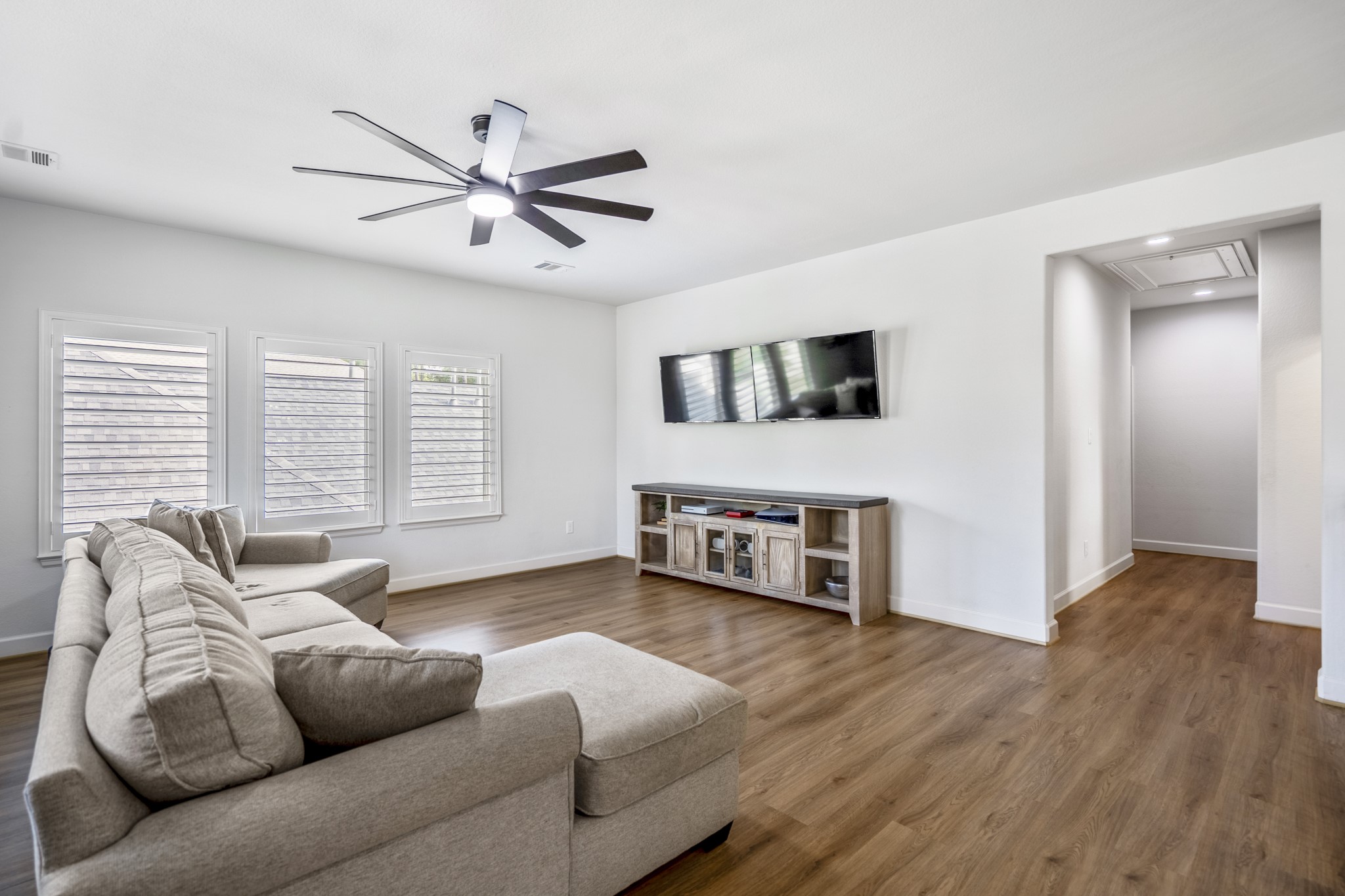 304 Mullins Court Montgomery, TX 77316 - Photo 21 of 50 Ample natural light beams through the 2nd level living space showcasing upgraded LVP flooring throughout.