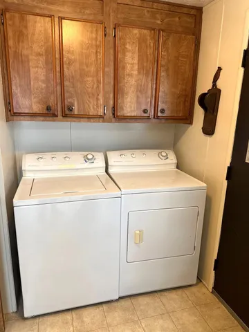 a view of a patio with table and chairs potted plants with wooden floor