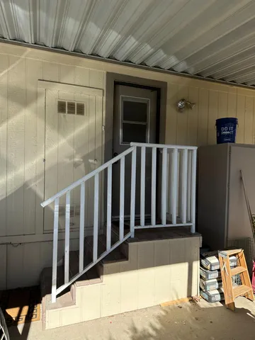 a view of a house with a backyard