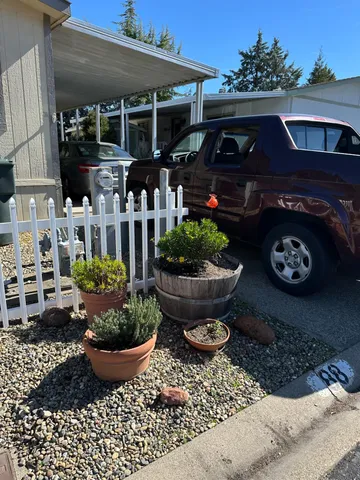 a view of a house with swimming pool and yard