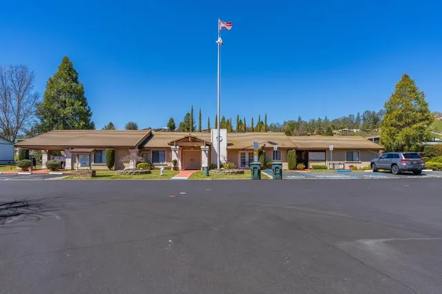 an aerial view of a house with swimming pool and outdoor space
