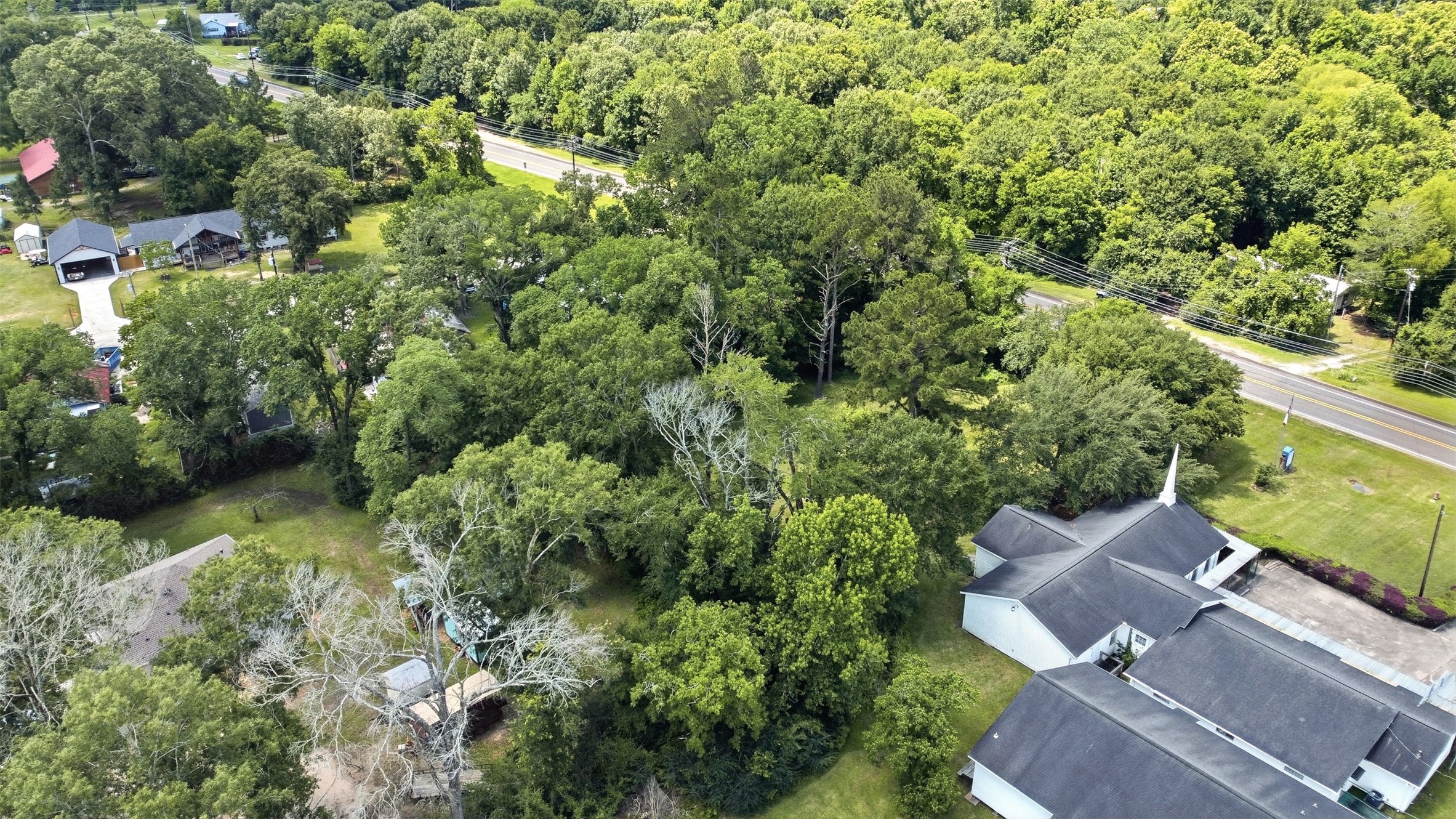 0 State Highway Loop Goodrich, TX 77335 - Photo 12 of 22 an aerial view of residential house with outdoor space and trees all around