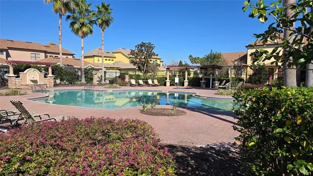 a view of a park with plants and a bench