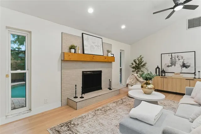 a living room with furniture and a fireplace