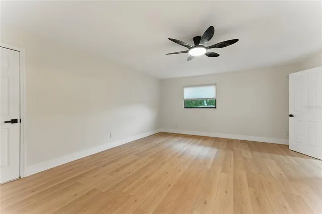 a bathroom with a sink mirror and a bathtub