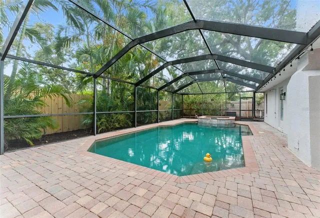 a view of swimming pool with a yard