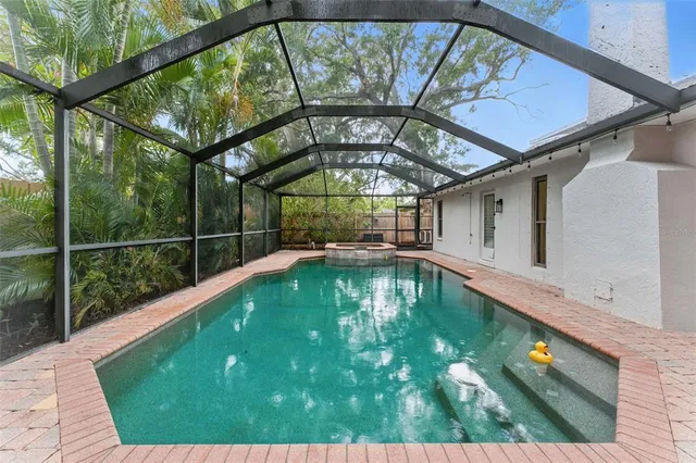 a view of a swimming pool with a patio