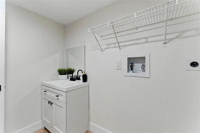 a view of backyard with wooden fence