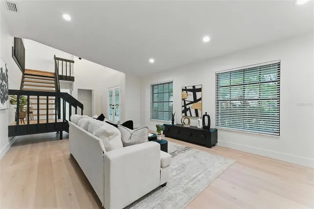 a living room with furniture and a window