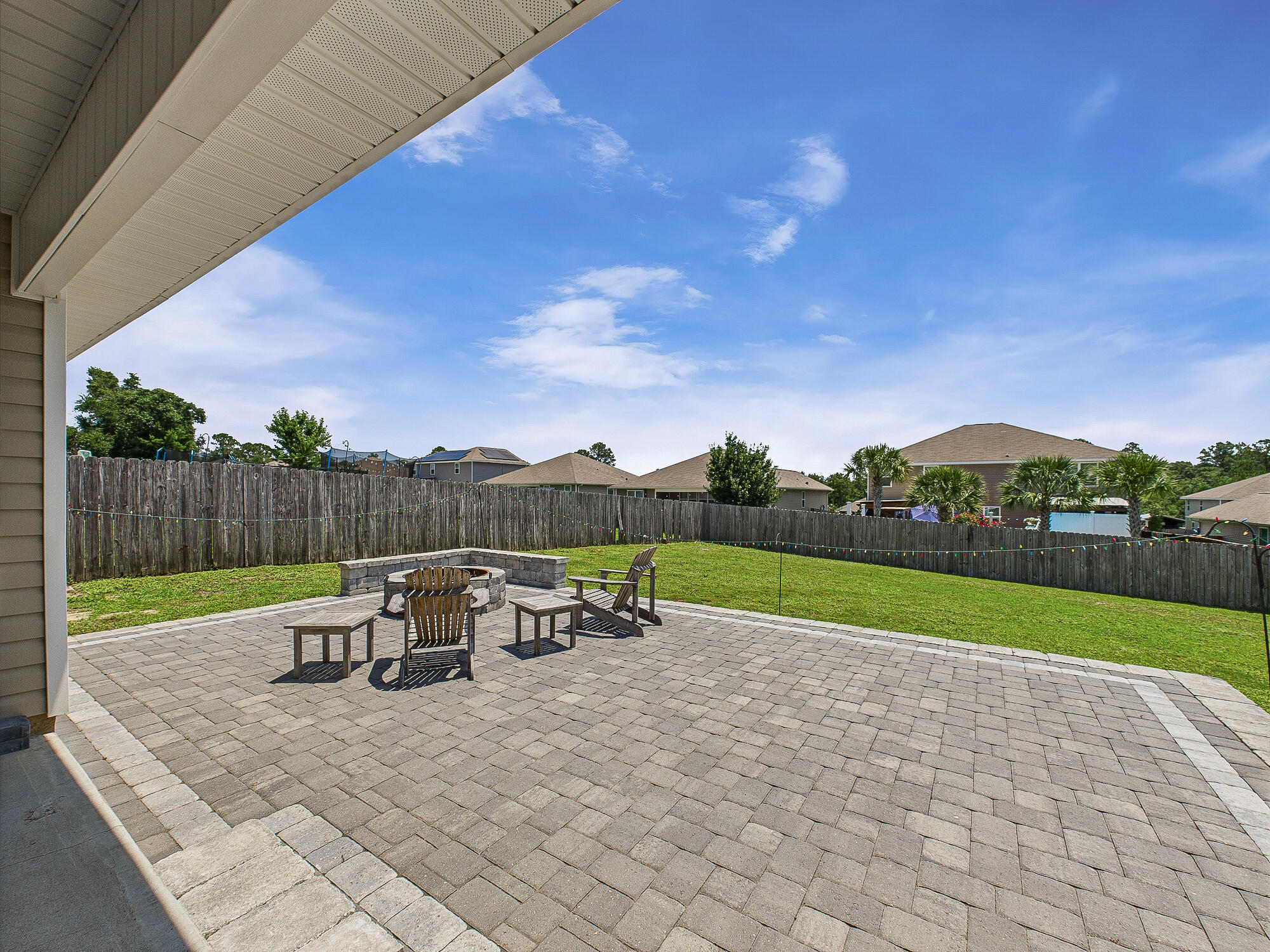 4611 Plover Drive Crestview, FL 32539 - Photo 24 of 27 a view of a patio with table and chairs under an umbrella