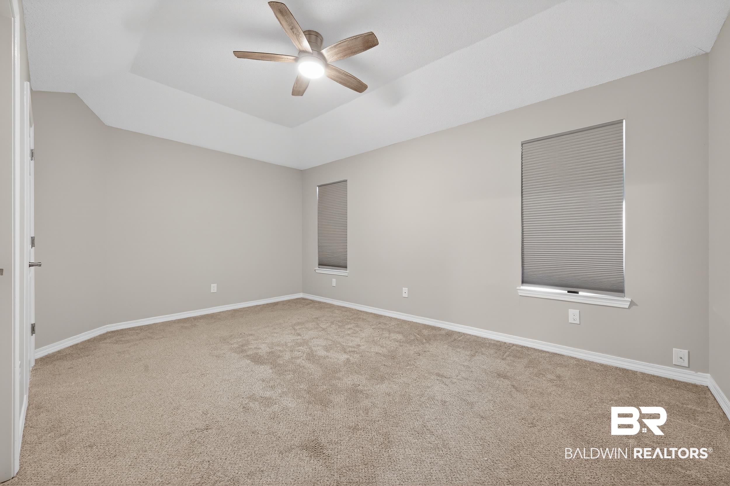 7050 Highpointe Place West Daphne, AL 36527 - Photo 44 of 66 Unfurnished room with light colored carpet, a ceiling fan, and a raised ceiling
