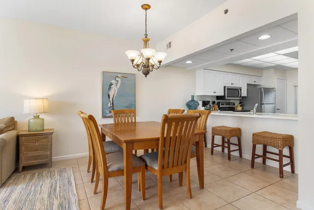 a bedroom with a bed and a tv on the dresser