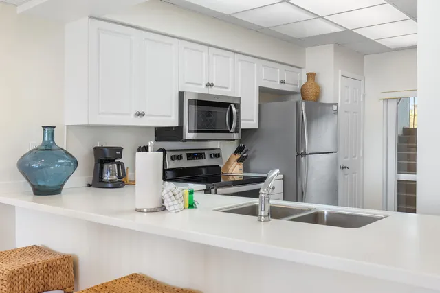 a bedroom with a large bed and a flat screen tv