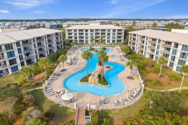 a view of a swimming pool with outdoor seating