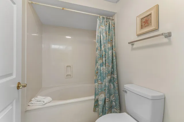 a view of a building with a garden and plants