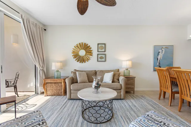 a view of a dining room with furniture and a chandelier