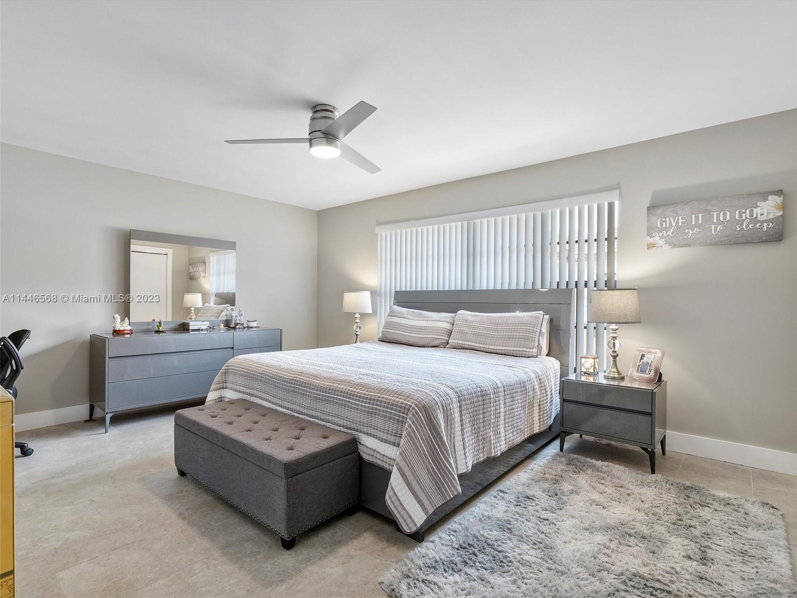 2358 Southwest 70th Way, Unit 6 Davie, FL 33317 - Photo 12 of 55 a spacious bedroom with a bed and window