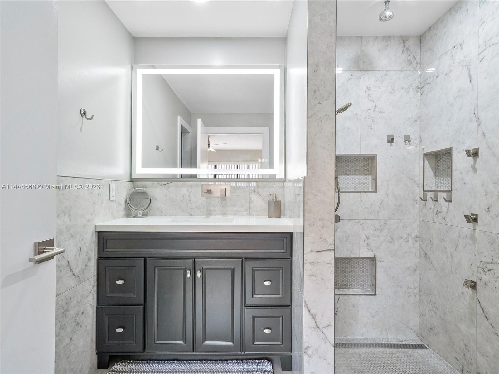 2358 Southwest 70th Way, Unit 6 Davie, FL 33317 - Photo 15 of 55 a bathroom with a sink double vanity and a mirror