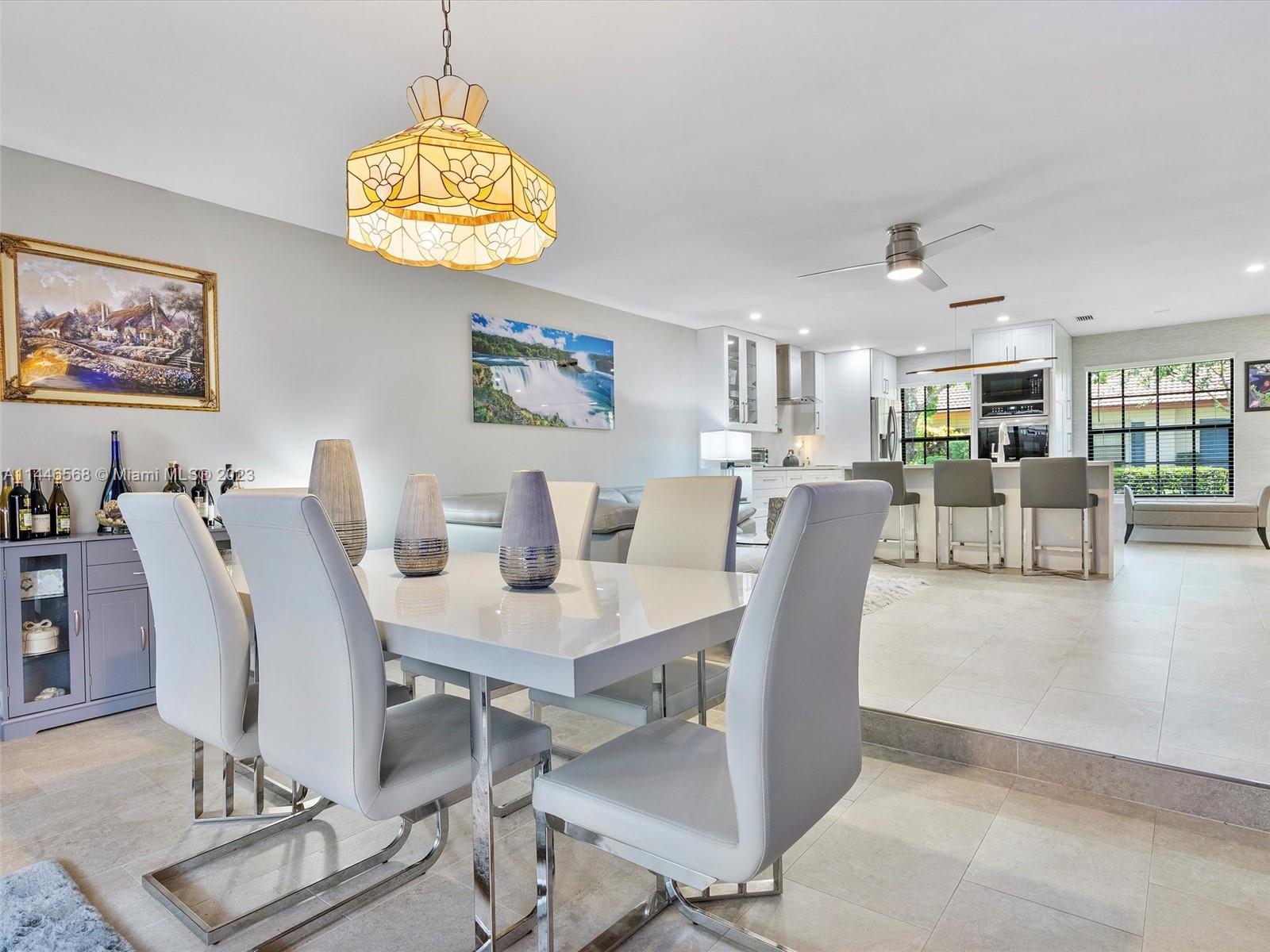 2358 Southwest 70th Way, Unit 6 Davie, FL 33317 - Photo 27 of 55 a view of a dining room with furniture