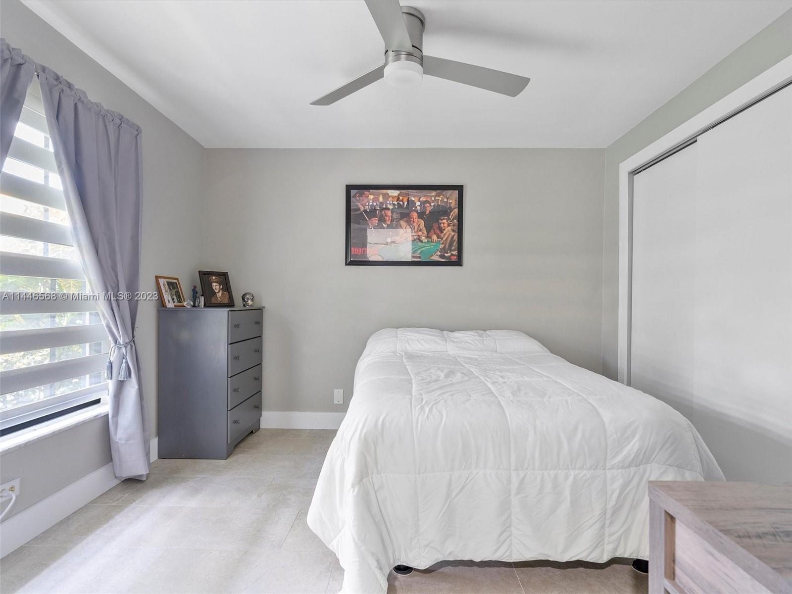 2358 Southwest 70th Way, Unit 6 Davie, FL 33317 - Photo 30 of 55 a bedroom with a bed and a window