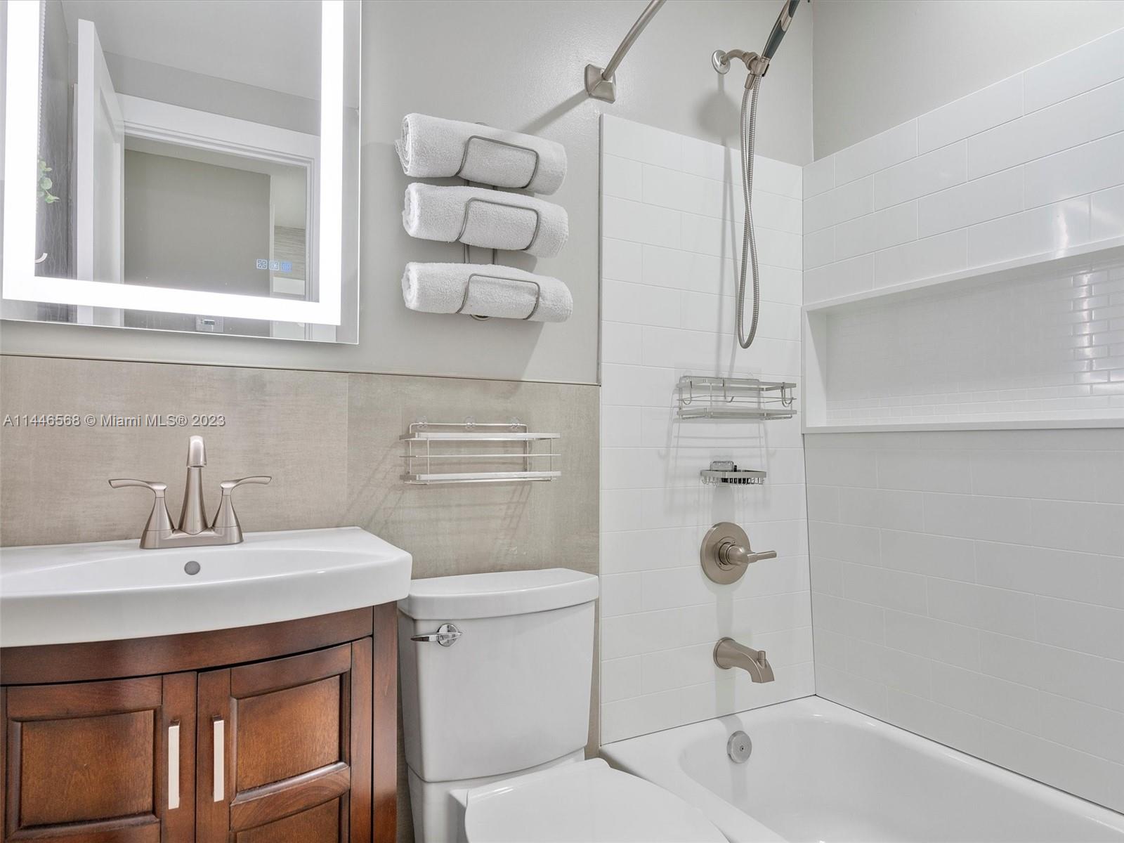 2358 Southwest 70th Way, Unit 6 Davie, FL 33317 - Photo 33 of 55 a bathroom with a sink a toilet and shower