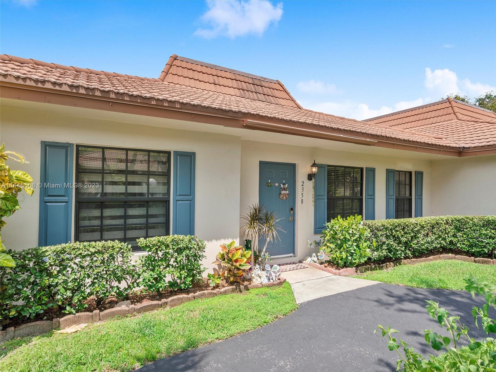 2358 Southwest 70th Way, Unit 6 Davie, FL 33317 - Photo 4 of 55 front view of a house with a yard