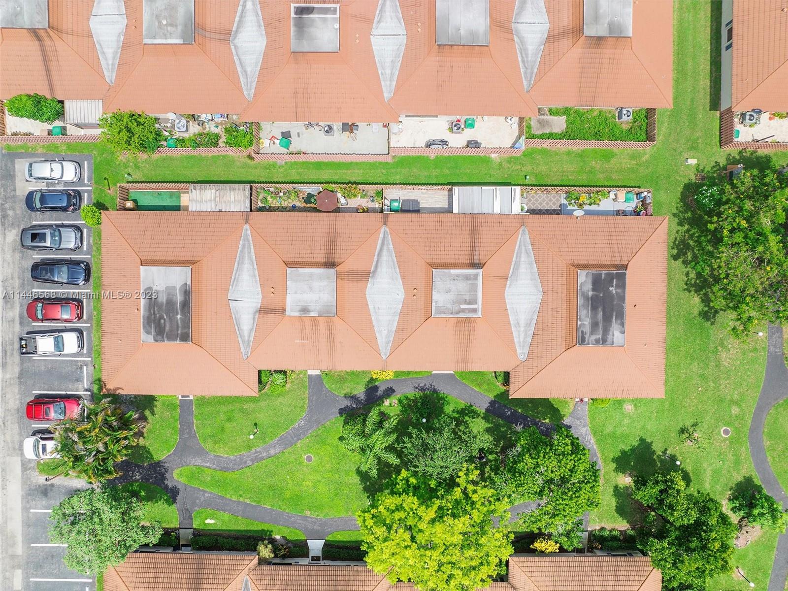 2358 Southwest 70th Way, Unit 6 Davie, FL 33317 - Photo 43 of 55 an aerial view of a house with a yard and a large pool table and chairs