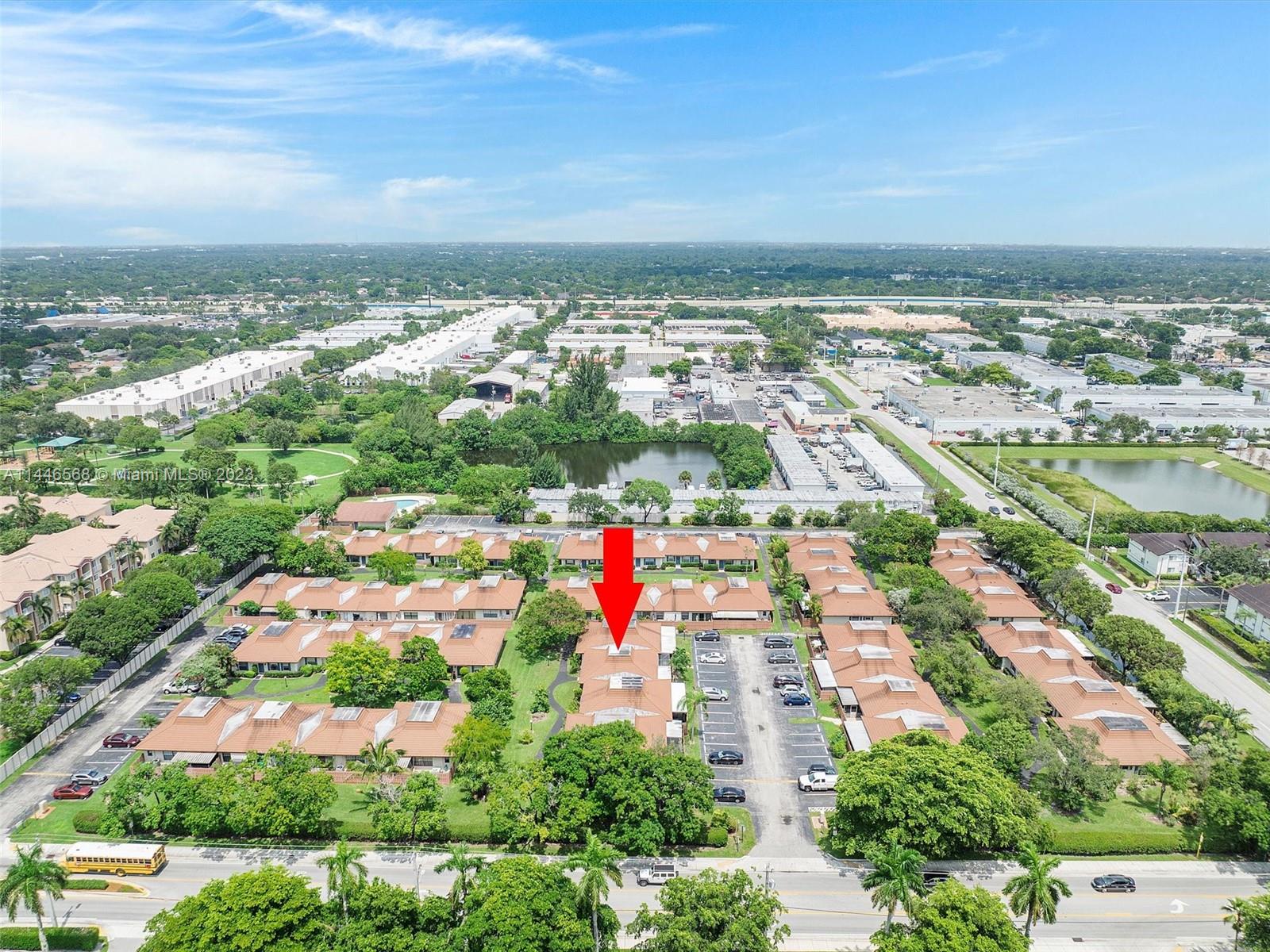 2358 Southwest 70th Way, Unit 6 Davie, FL 33317 - Photo 46 of 55 an aerial view of residential building and lake
