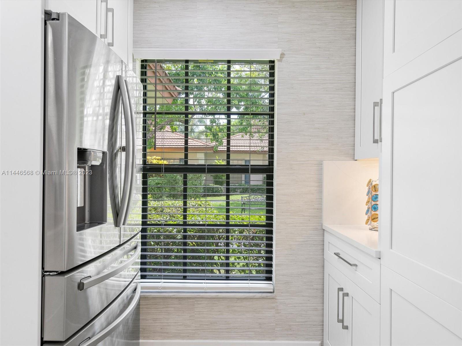 2358 Southwest 70th Way, Unit 6 Davie, FL 33317 - Photo 8 of 55 a white refrigerator freezer and a dishwasher