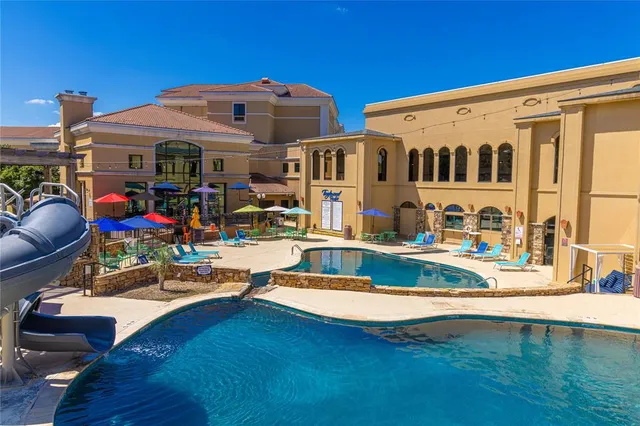 a view of a house with swimming pool