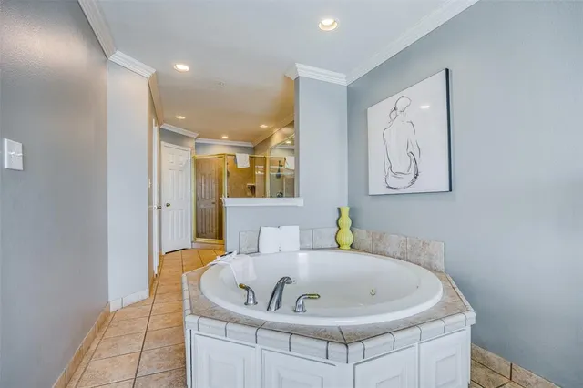a bathroom with a tub and sink